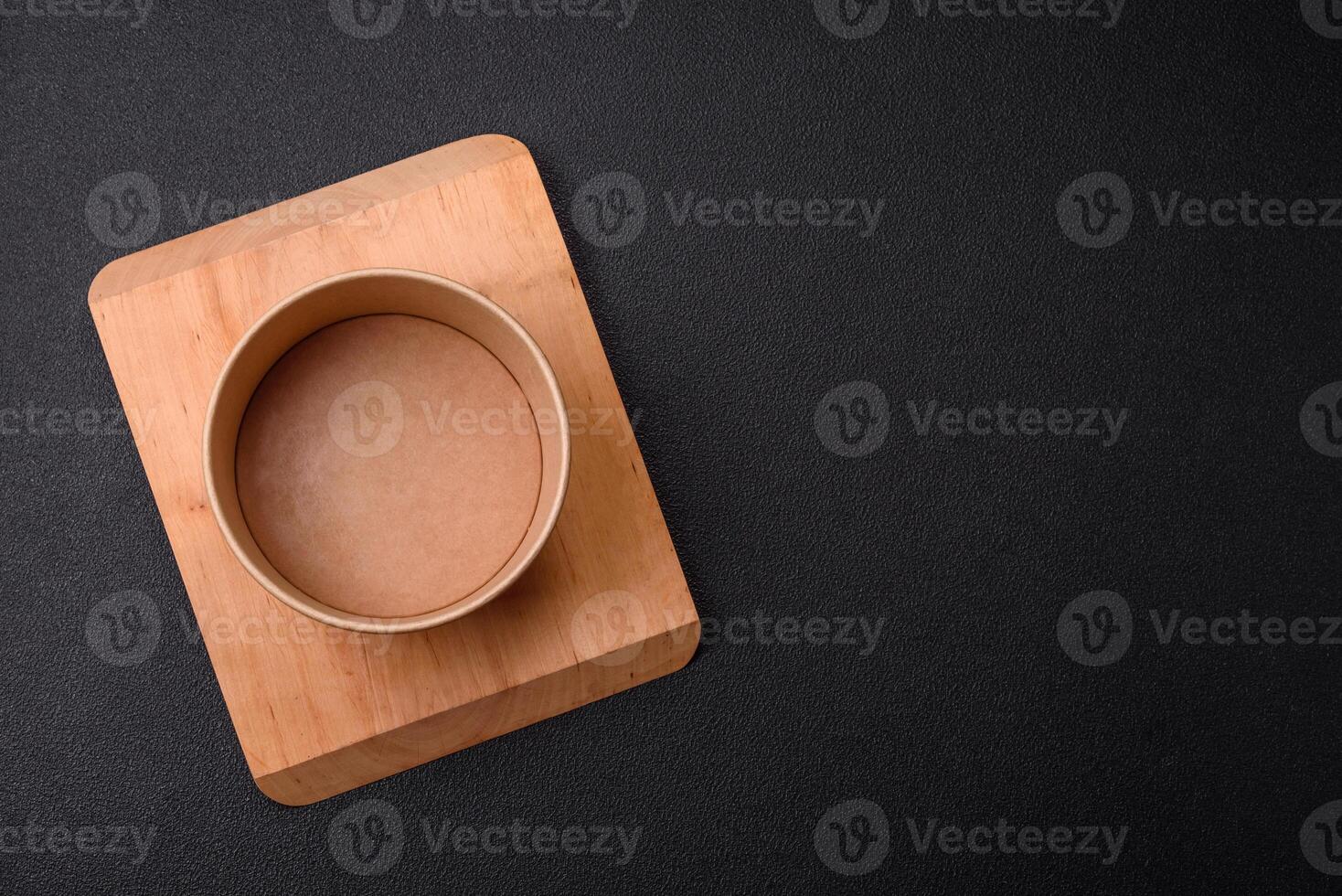 Empty ceramic round plate on dark textured concrete background photo