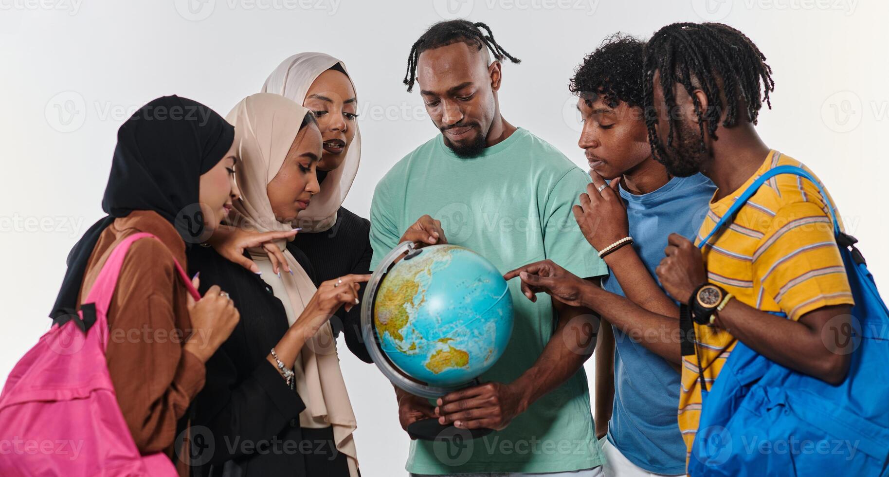 A diverse group of students is gathered around a globe, engrossed in exploration and study, their vibrant energy captured against a pristine white background, symbolizing unity and curiosity in their photo