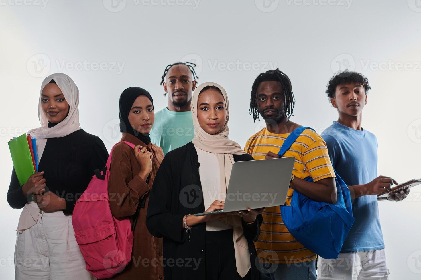 Group of diverse students engages in modern educational practices, utilizing a variety of technological tools such as laptops, tablets, and smartphones against a clean white background, exemplifying photo