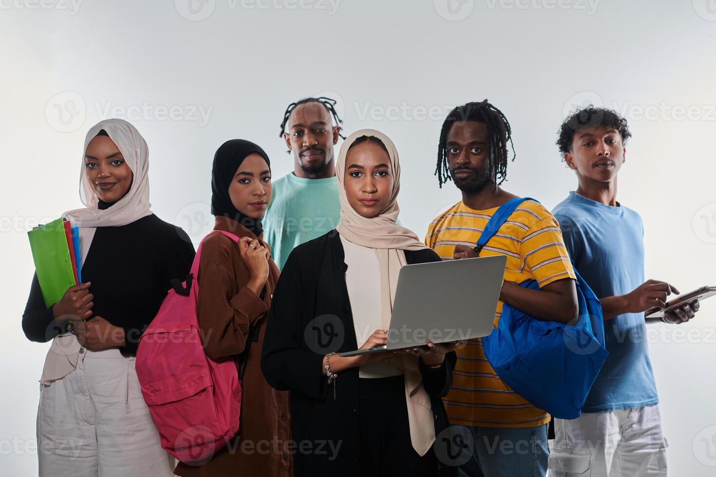 Group of diverse students engages in modern educational practices, utilizing a variety of technological tools such as laptops, tablets, and smartphones against a clean white background, exemplifying photo
