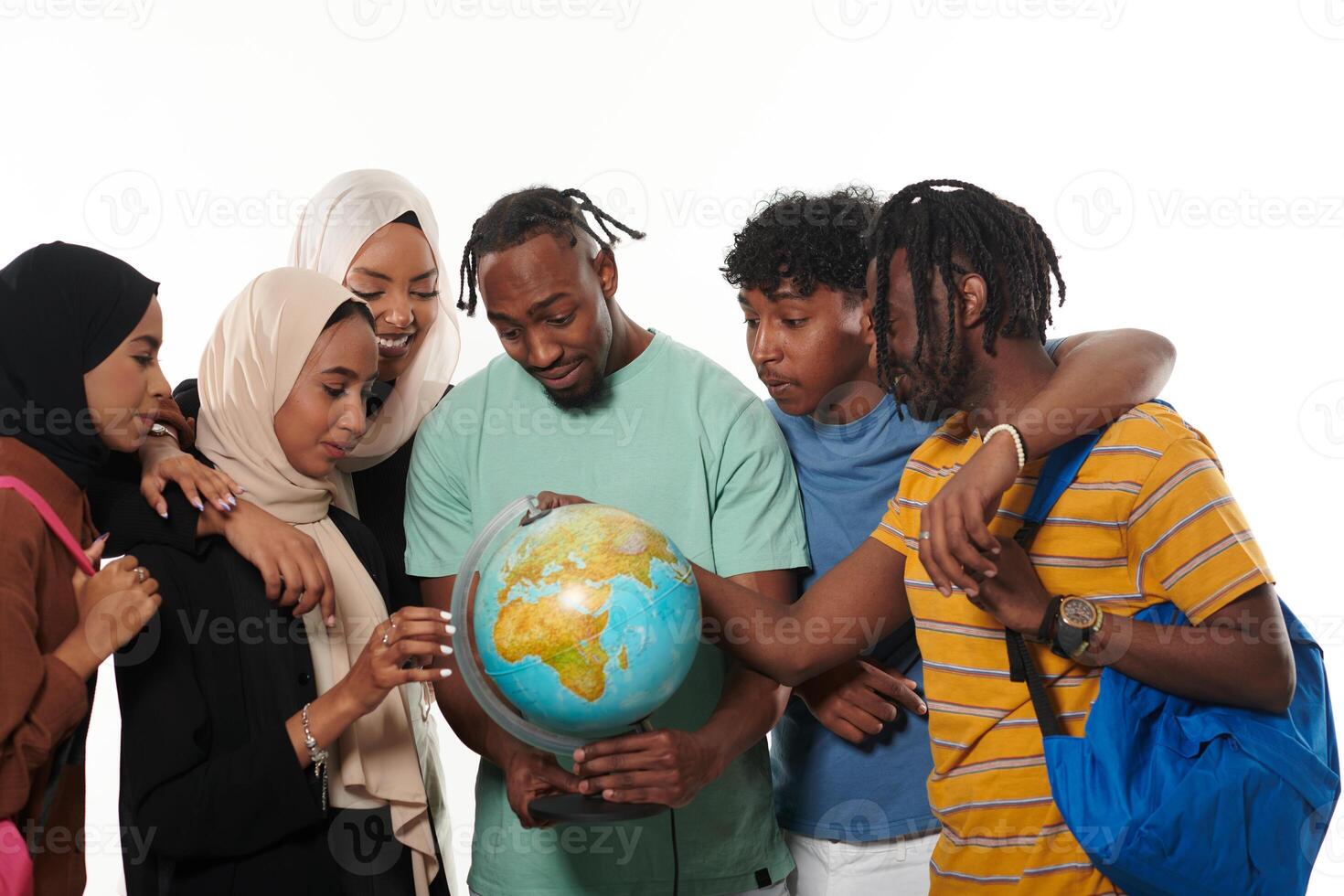 A diverse group of students is gathered around a globe, engrossed in exploration and study, their vibrant energy captured against a pristine white background, symbolizing unity and curiosity in their photo