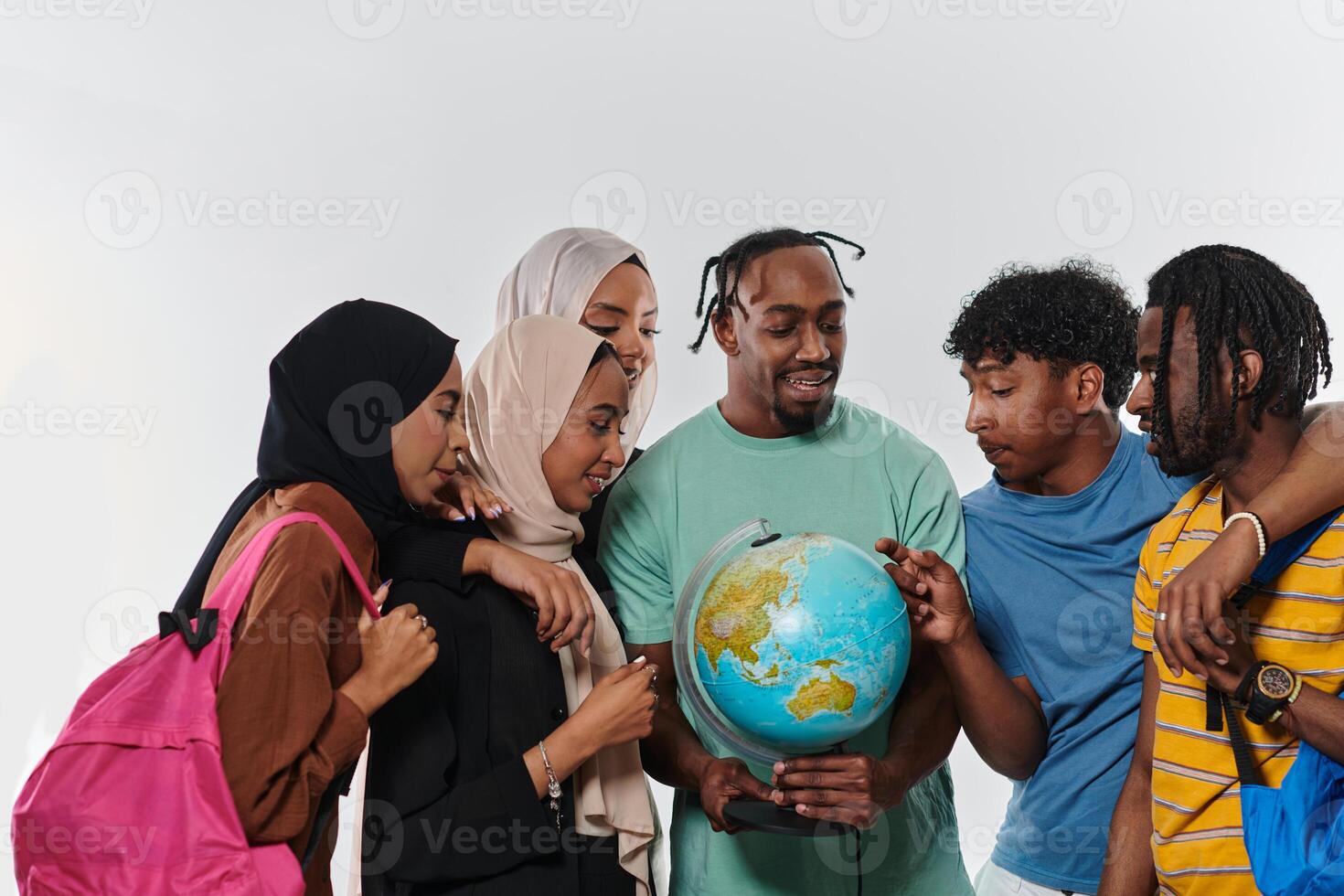 A diverse group of students is gathered around a globe, engrossed in exploration and study, their vibrant energy captured against a pristine white background, symbolizing unity and curiosity in their photo