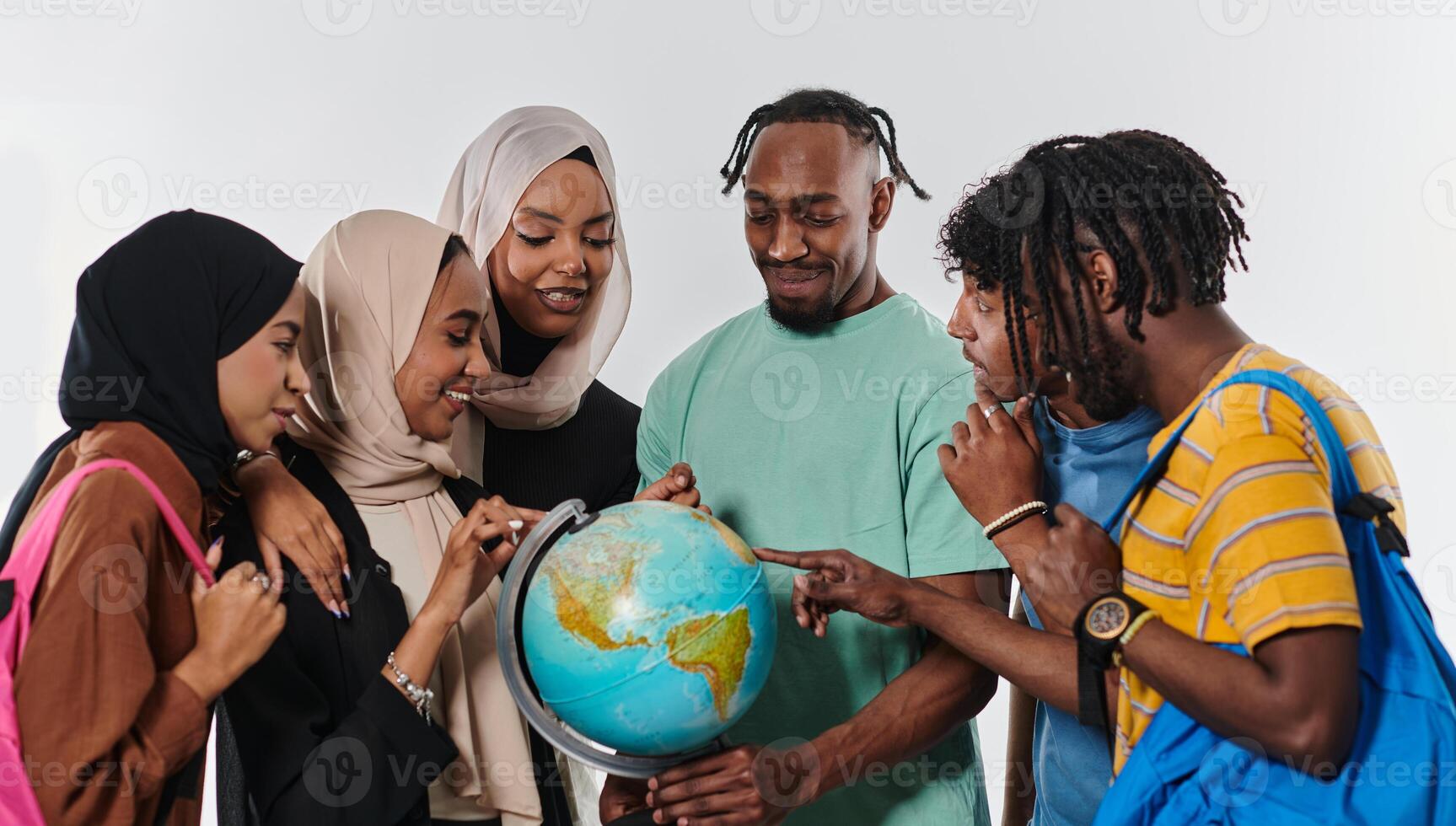 A diverse group of students is gathered around a globe, engrossed in exploration and study, their vibrant energy captured against a pristine white background, symbolizing unity and curiosity in their photo