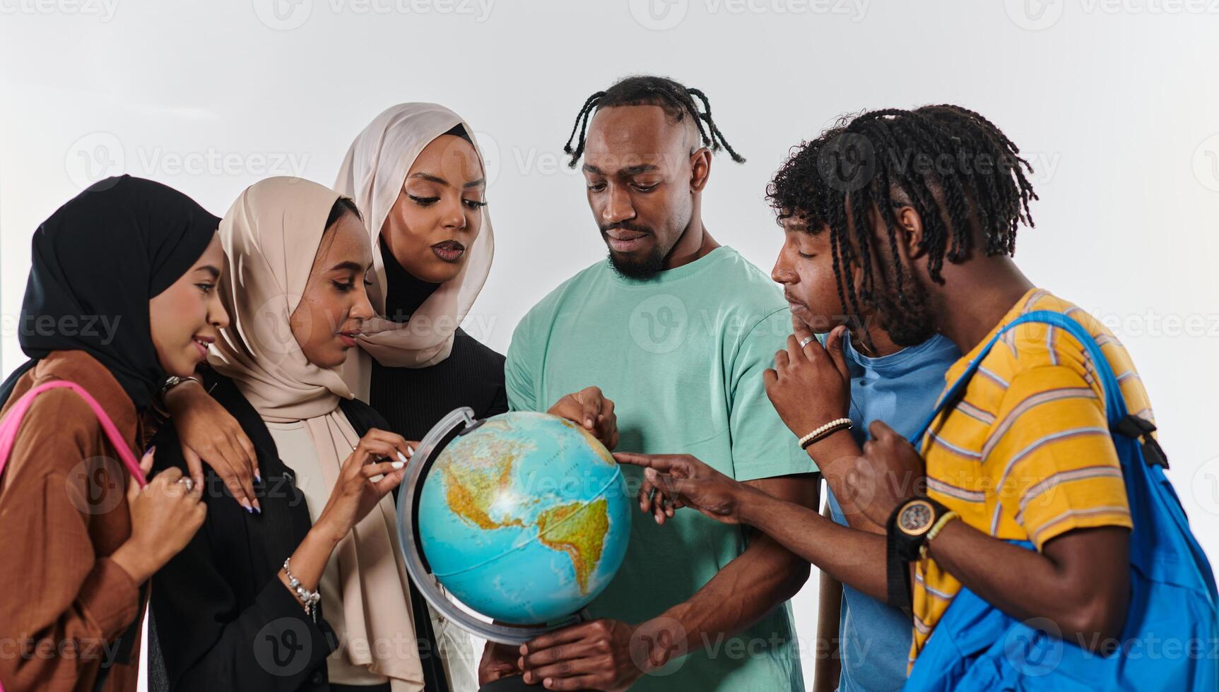 A diverse group of students is gathered around a globe, engrossed in exploration and study, their vibrant energy captured against a pristine white background, symbolizing unity and curiosity in their photo