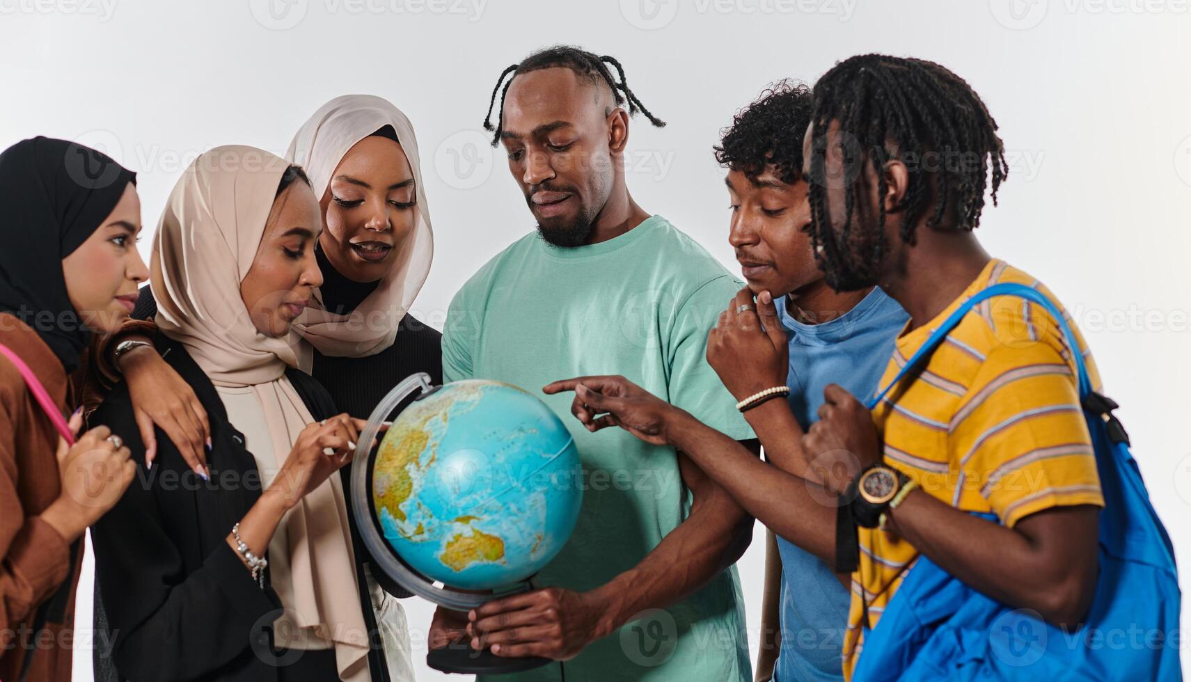 A diverse group of students is gathered around a globe, engrossed in exploration and study, their vibrant energy captured against a pristine white background, symbolizing unity and curiosity in their photo