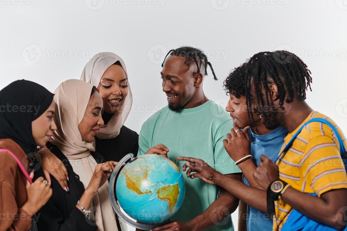 A diverse group of students is gathered around a globe, engrossed in exploration and study, their vibrant energy captured against a pristine white background, symbolizing unity and curiosity in their photo