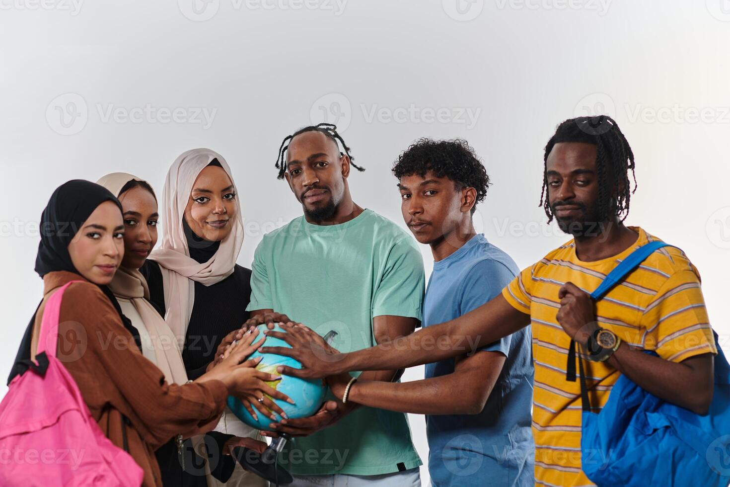 A diverse group of students is gathered around a globe, engrossed in exploration and study, their vibrant energy captured against a pristine white background, symbolizing unity and curiosity in their photo