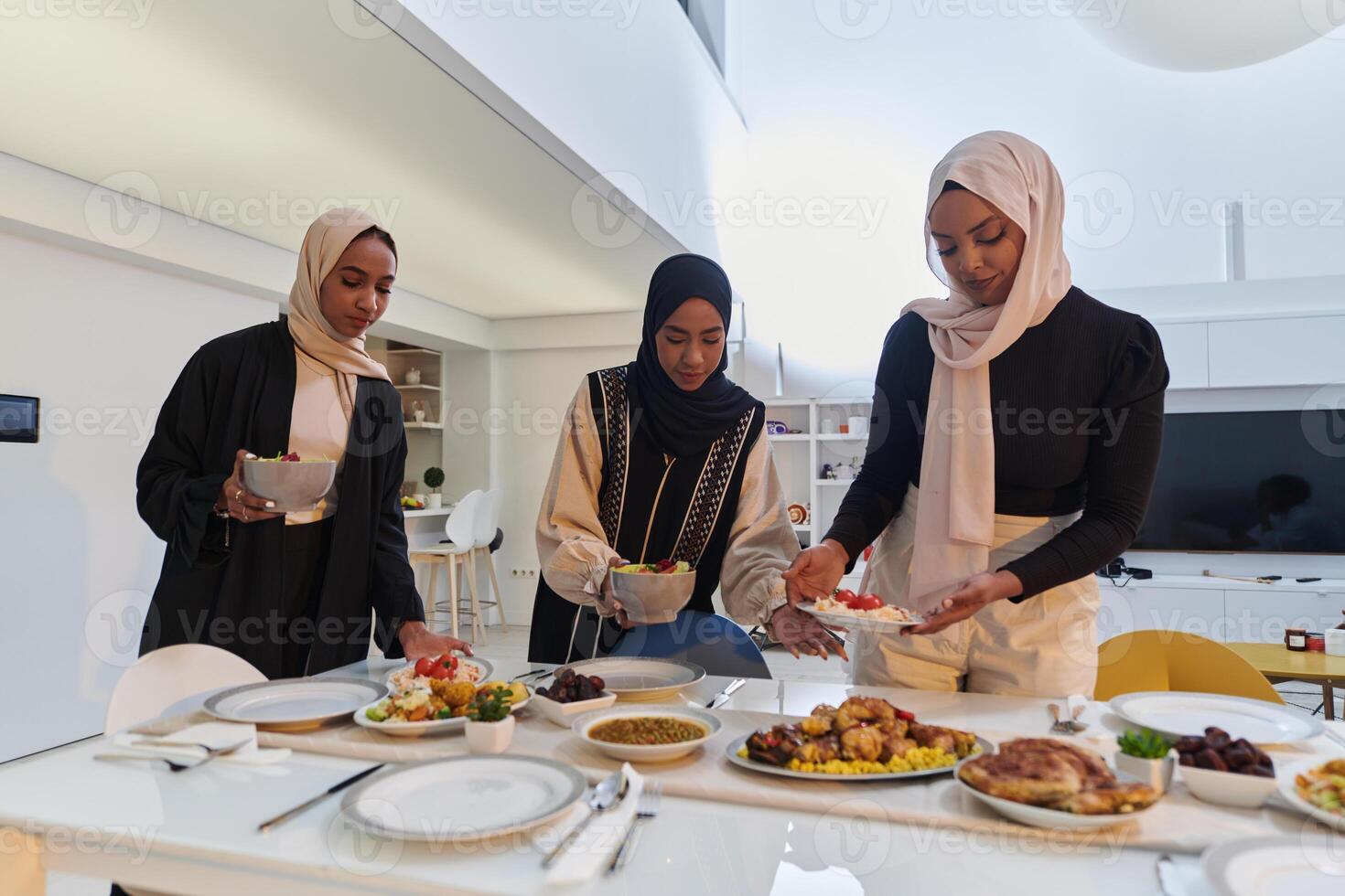 Group of young Arab women come together to lovingly prepare an iftar table during the sacred Muslim month of Ramadan, embodying the essence of communal unity, cultural tradition, and joyous photo