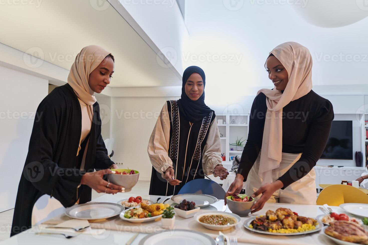 Group of young Arab women come together to lovingly prepare an iftar table during the sacred Muslim month of Ramadan, embodying the essence of communal unity, cultural tradition, and joyous photo
