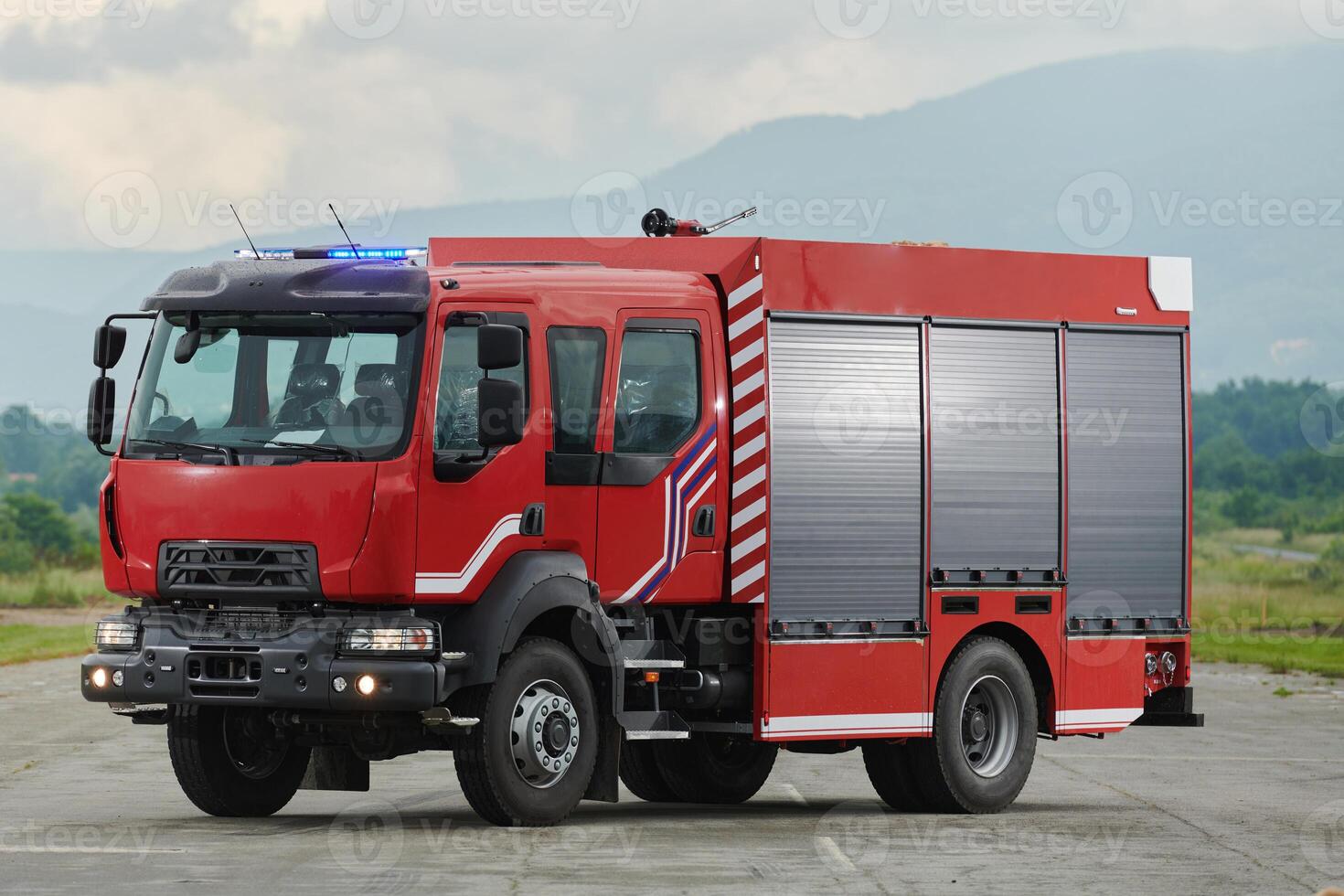 In this captivating scene, a state-of-the-art firetruck, equipped with advanced rescue technology, stands ready with its skilled firefighting team, prepared to intervene and respond rapidly to photo