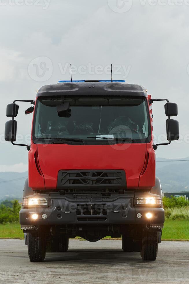 In this captivating scene, a state-of-the-art firetruck, equipped with advanced rescue technology, stands ready with its skilled firefighting team, prepared to intervene and respond rapidly to photo