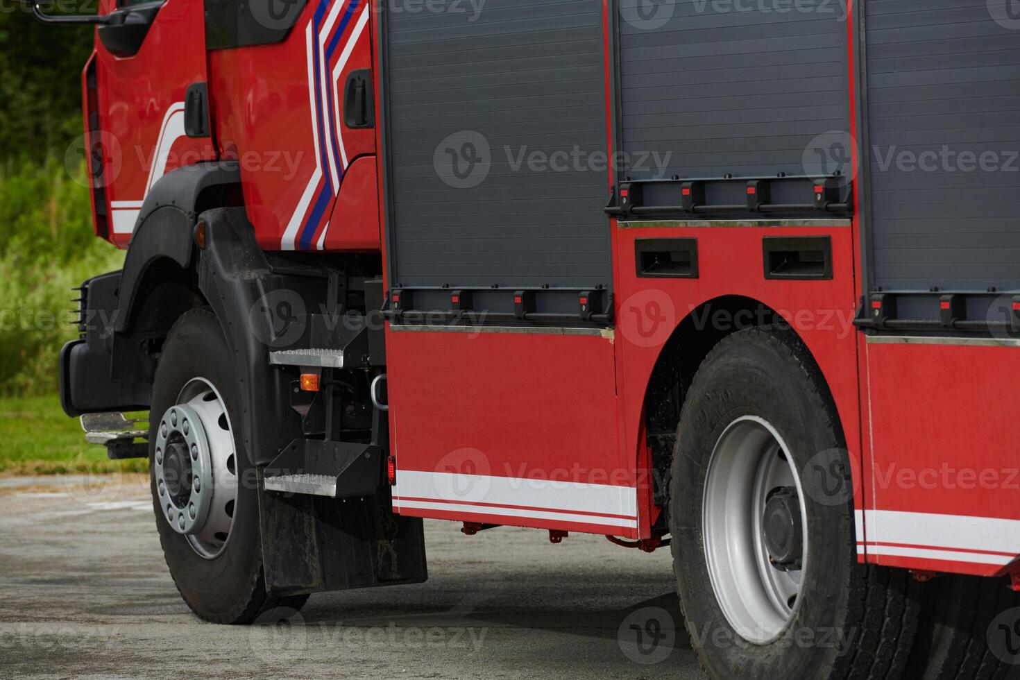 In this captivating scene, a state-of-the-art firetruck, equipped with advanced rescue technology, stands ready with its skilled firefighting team, prepared to intervene and respond rapidly to photo