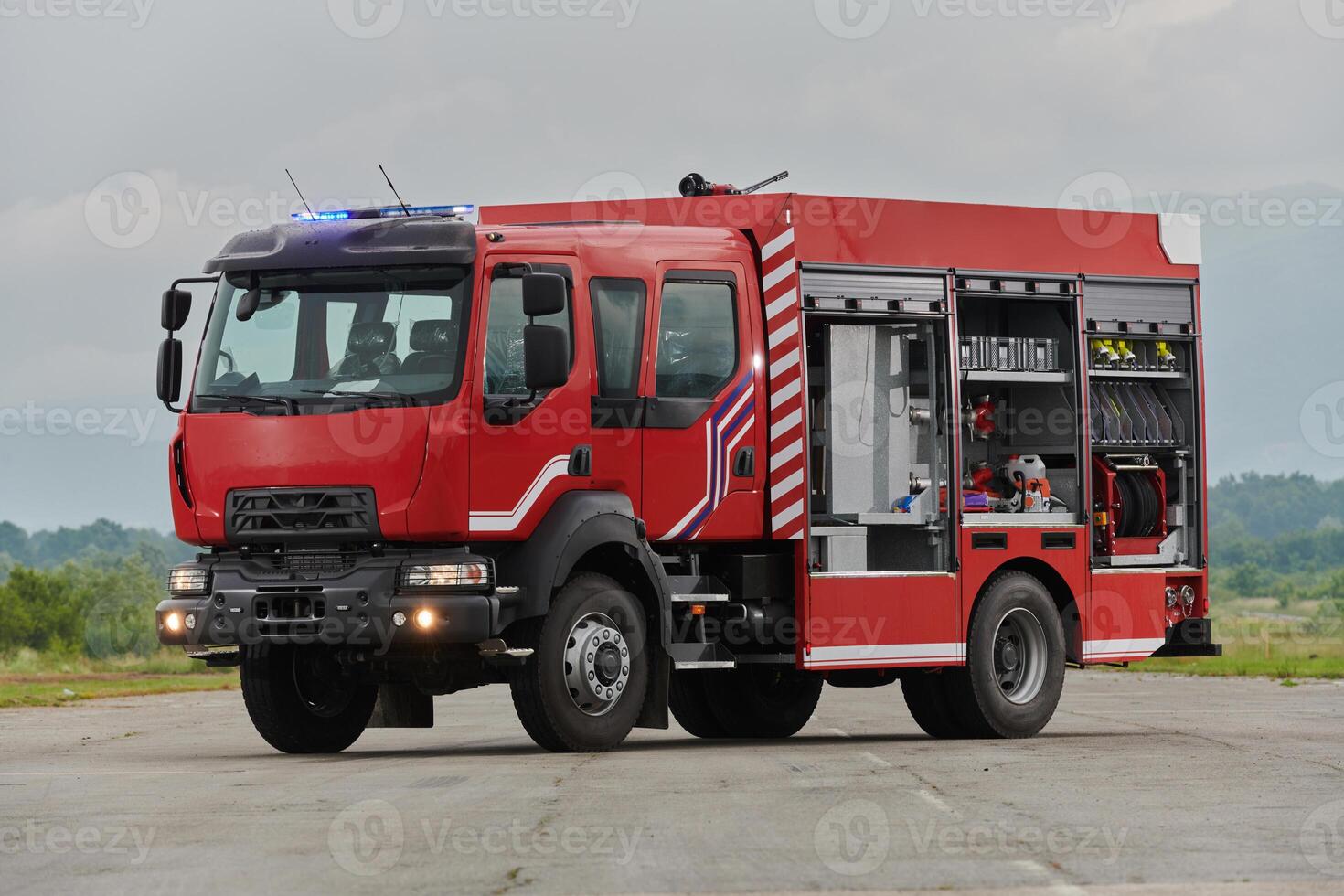 In this captivating scene, a state-of-the-art firetruck, equipped with advanced rescue technology, stands ready with its skilled firefighting team, prepared to intervene and respond rapidly to photo