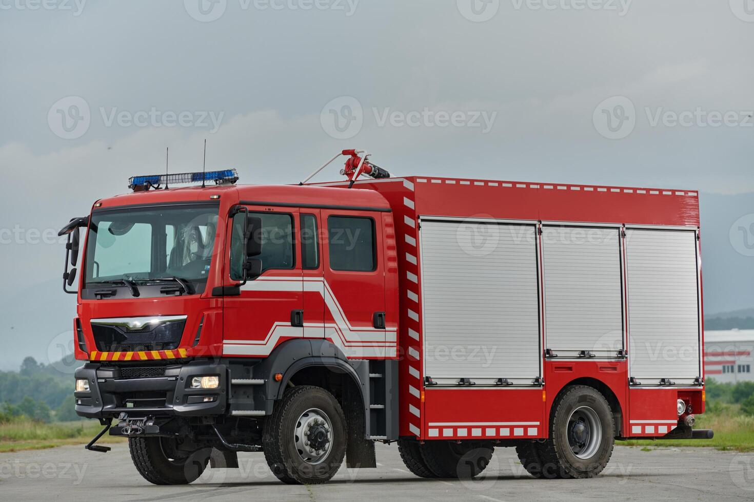 In this captivating scene, a state-of-the-art firetruck, equipped with advanced rescue technology, stands ready with its skilled firefighting team, prepared to intervene and respond rapidly to photo