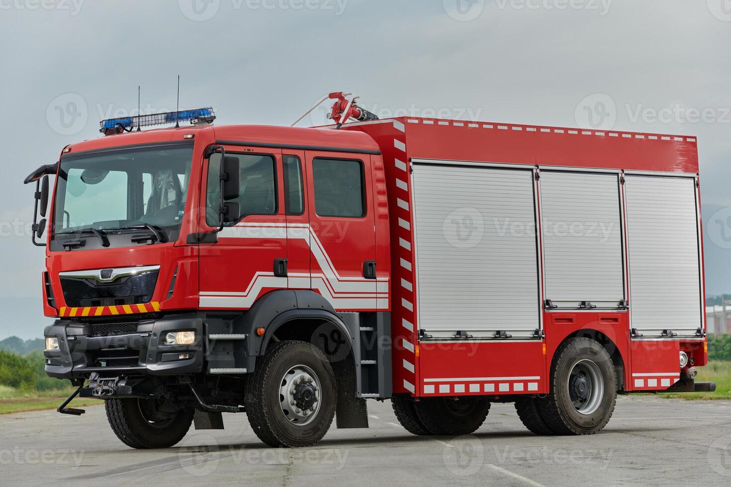 In this captivating scene, a state-of-the-art firetruck, equipped with advanced rescue technology, stands ready with its skilled firefighting team, prepared to intervene and respond rapidly to photo