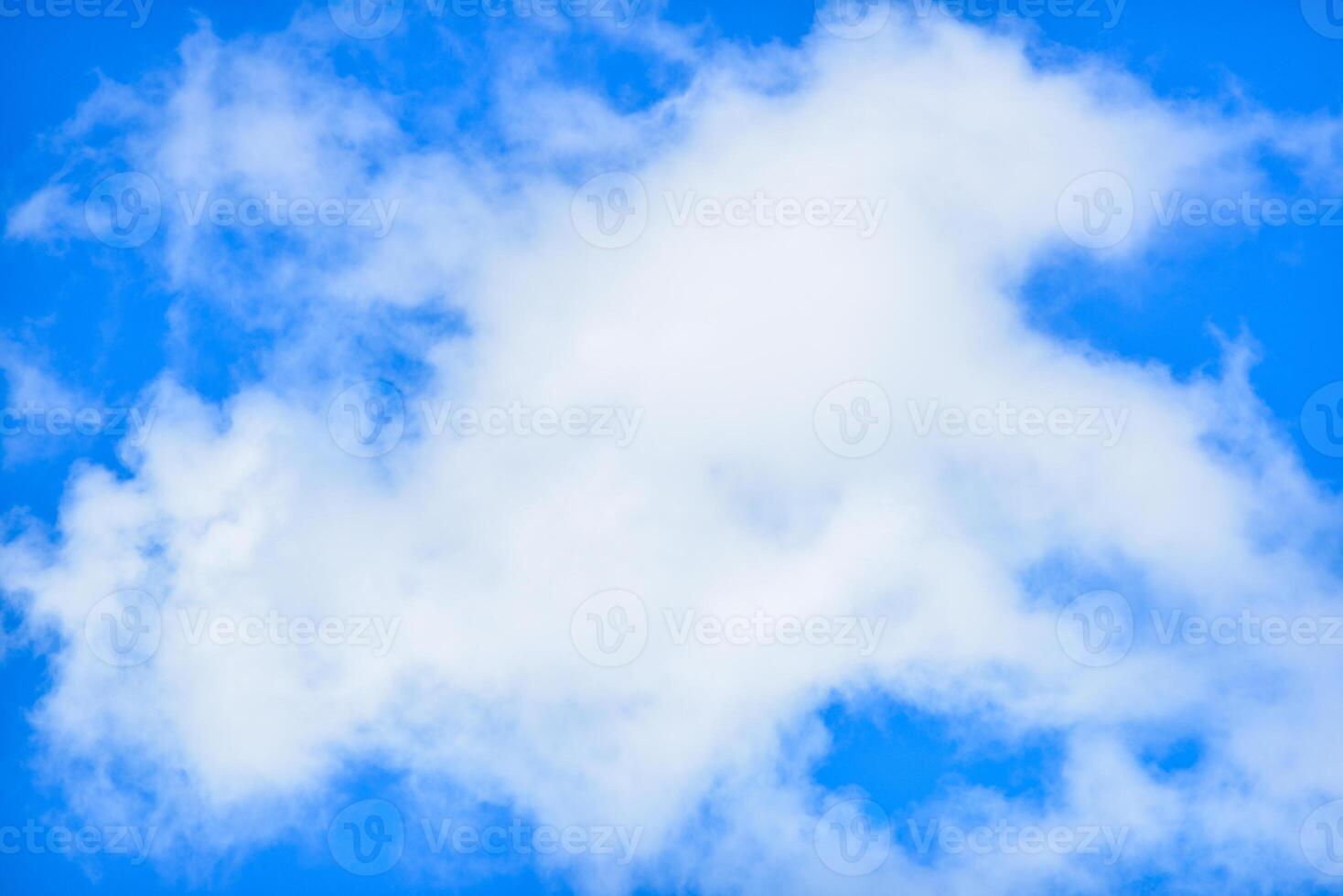 a white cloud is seen in the blue sky photo