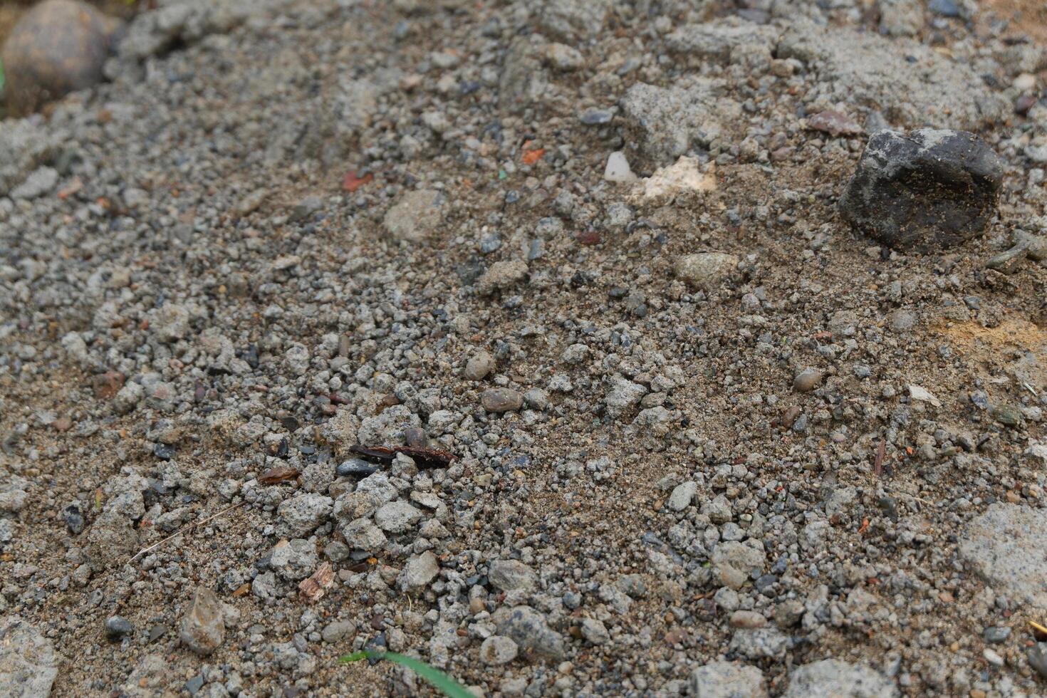 photography of rocky, sandy soil background texture photo