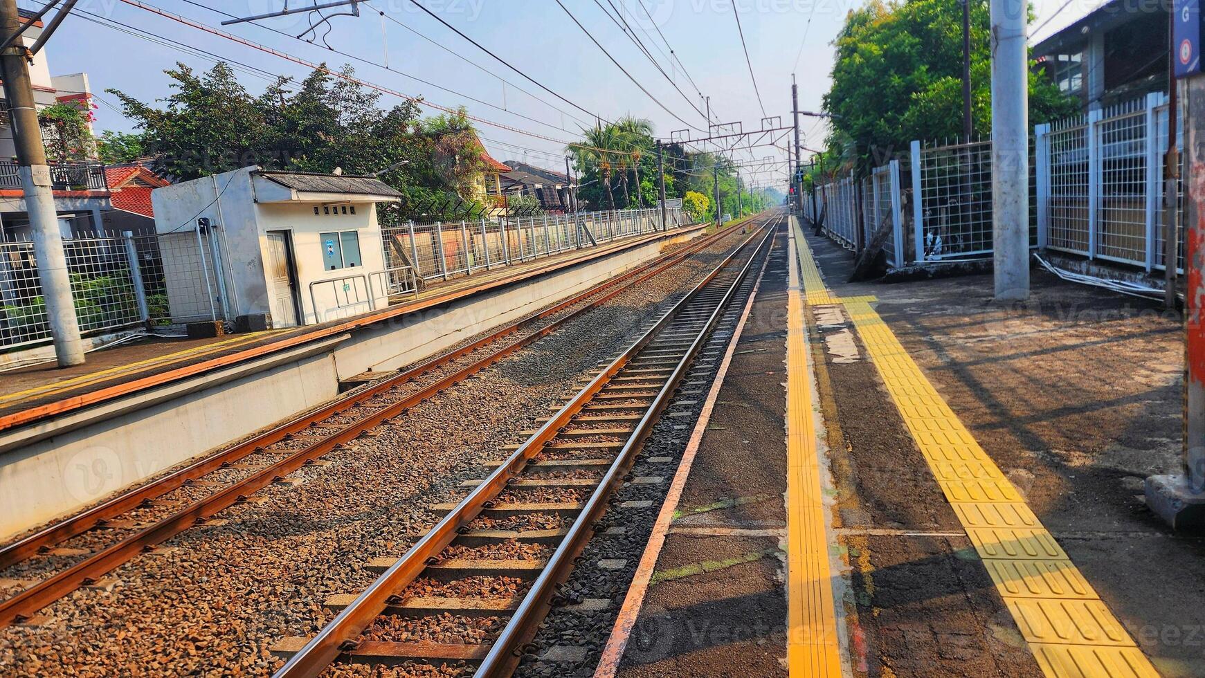 a train track with a yellow line on it photo