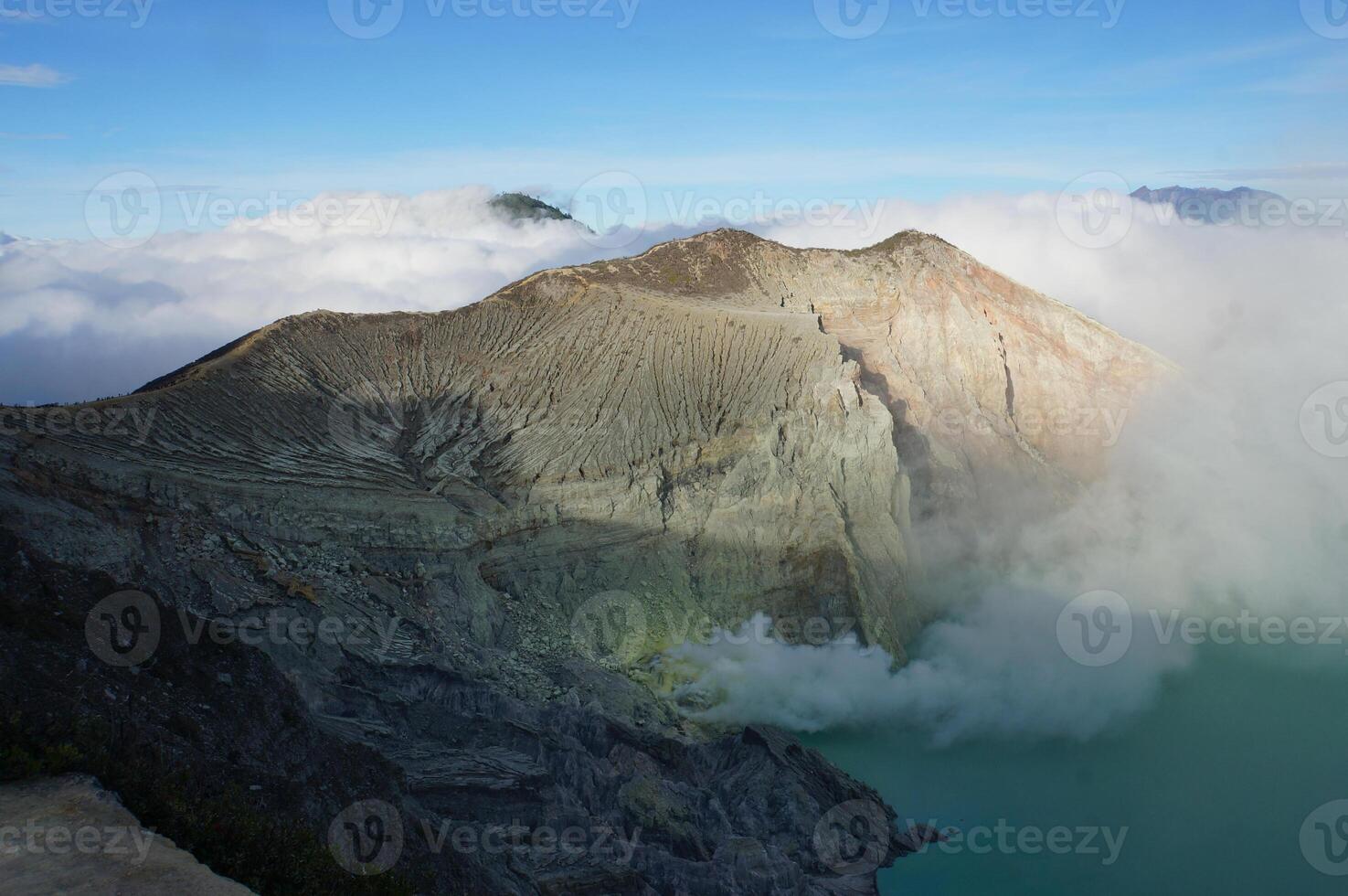 View of Ijen volcano in Indonesia, which has turquoise-coloured acidic crater lake photo