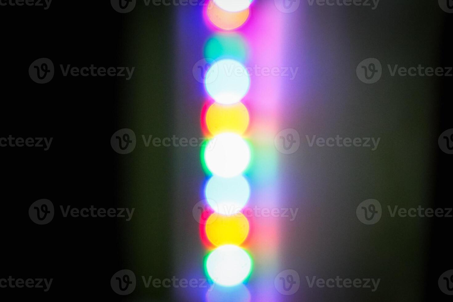 Defocused abstract background of red, blue, and green light in the night photo