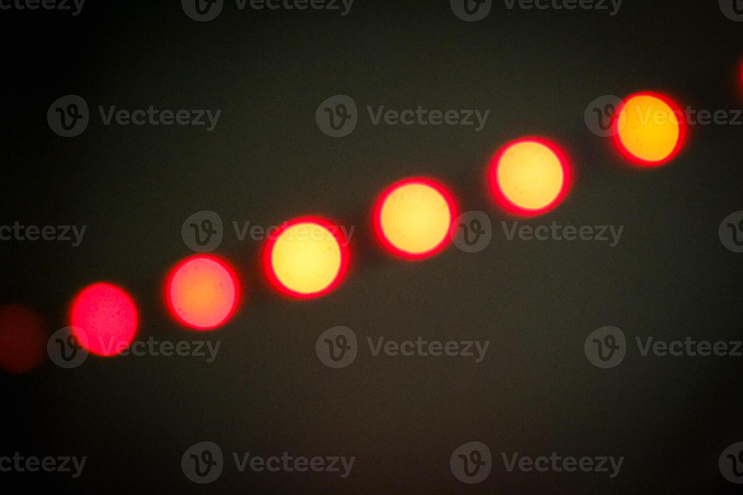Defocused abstract background of red light in the night photo