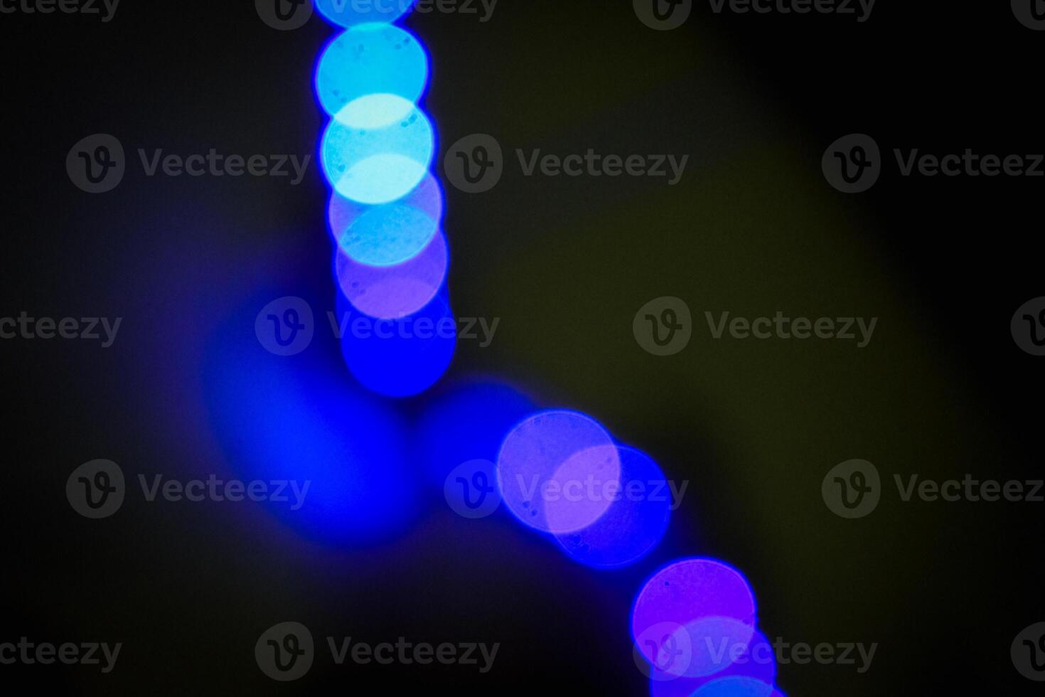 Defocused abstract background of blue light in the night photo