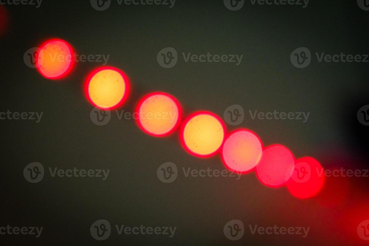 Defocused abstract background of red light in the night photo