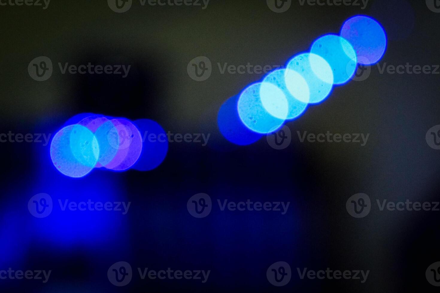 Defocused abstract background of blue light in the night photo