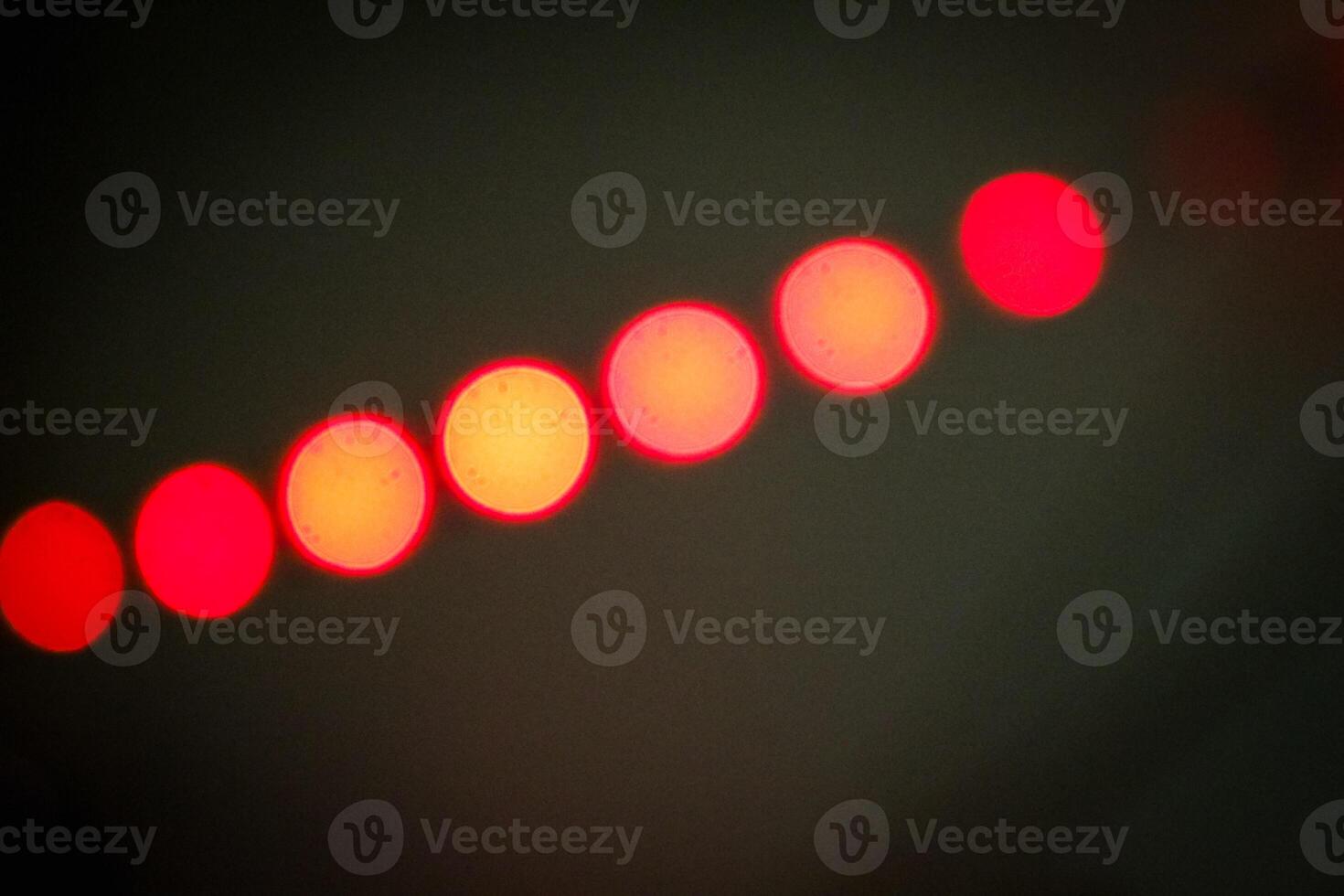 Defocused abstract background of red light in the night photo