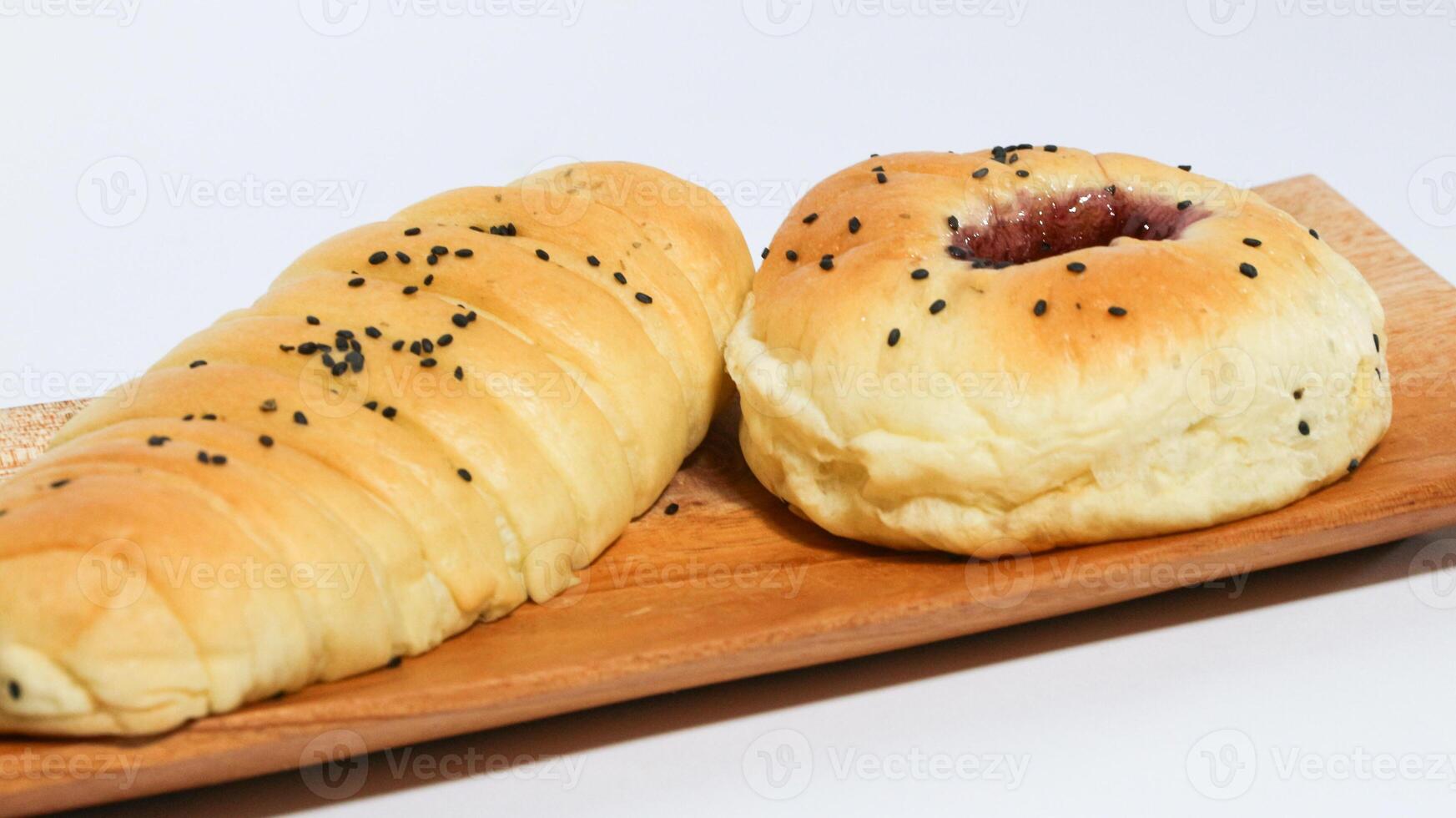 Indonesian bread filled with strawberries and chocolate banana bread isolated on white background. Selective focus photo