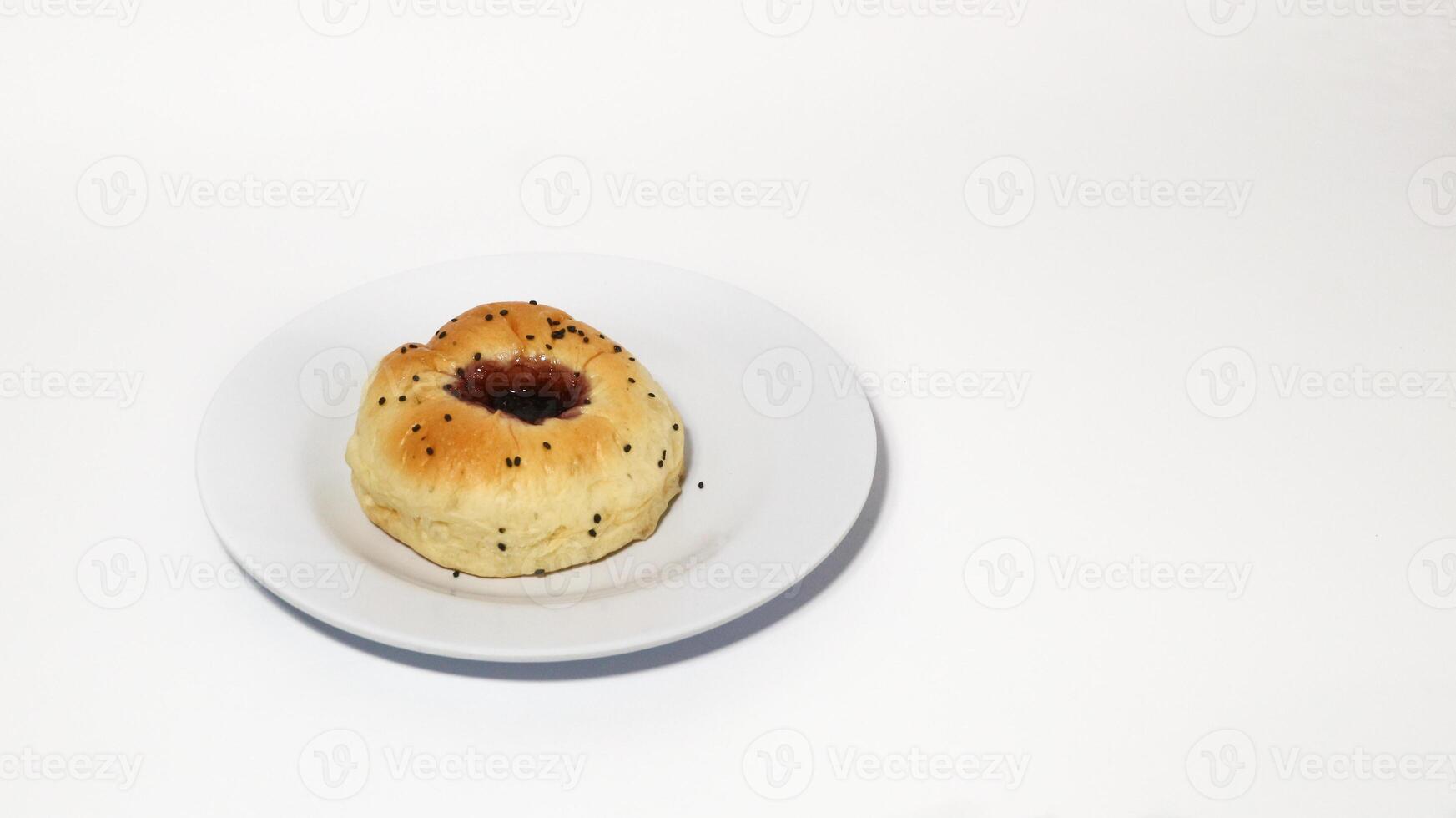 Indonesian bread filled with strawberries isolated on white background. Selective focus photo