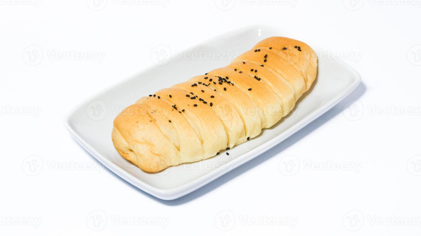 Traditional Indonesian snack called, chocolate banana bread which is bread filled with banana and chocolate jam served on a plate isolated on a white background photo