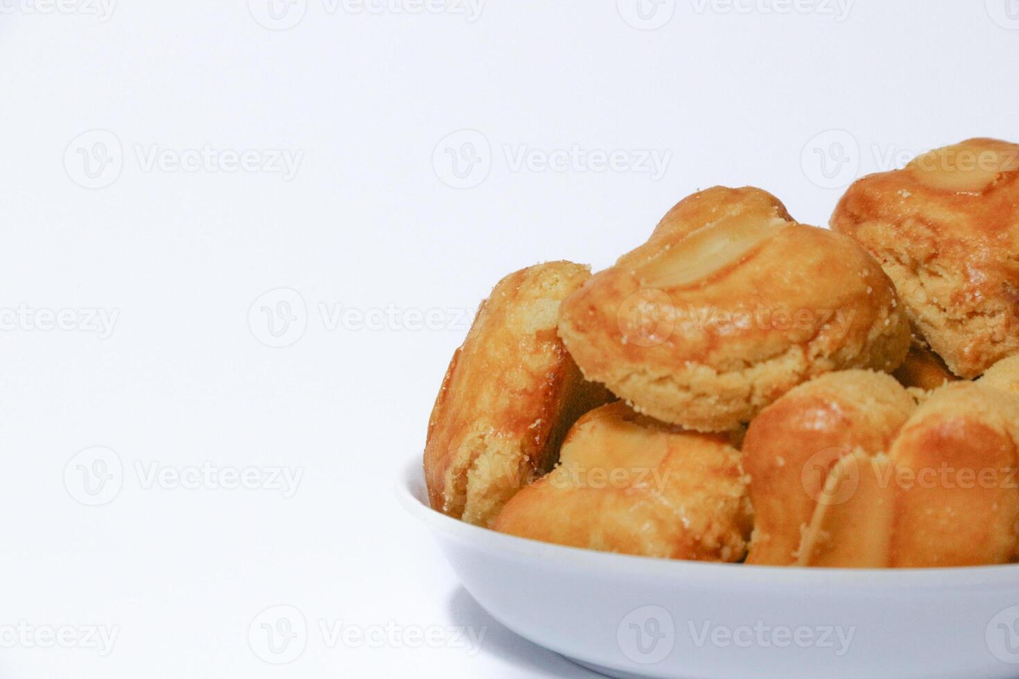 peanut almond cookies topped with sliced peanuts. photo
