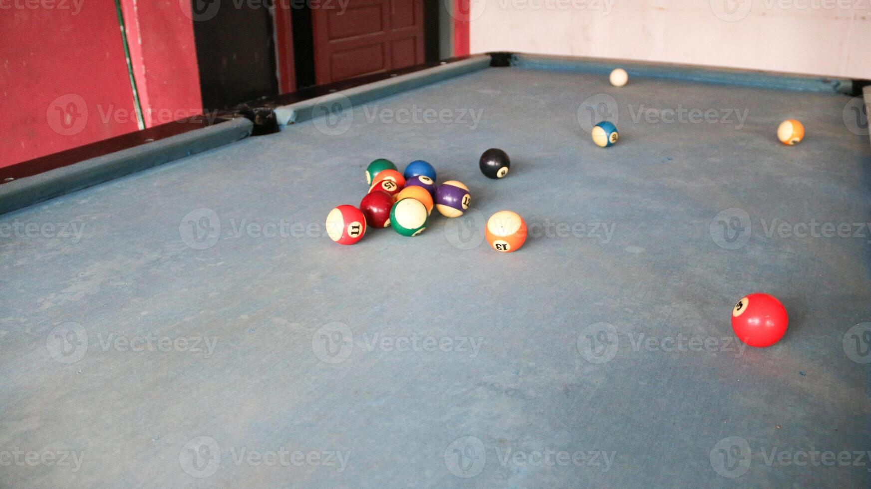 Billiards sports game. Multi-colored billiard balls with numbers on the pool table. Active recreation and entertainment. photo