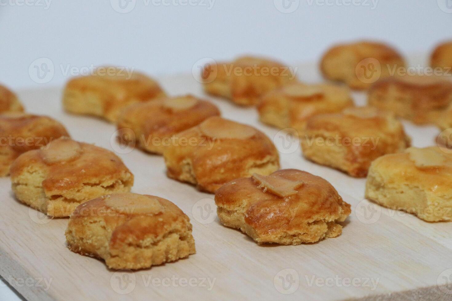 peanut almond cookies topped with sliced peanuts. photo