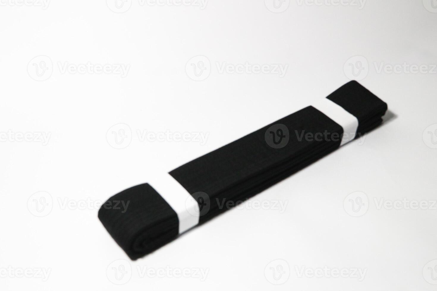 A picture of taekwondo belt on white background with selective focus photo