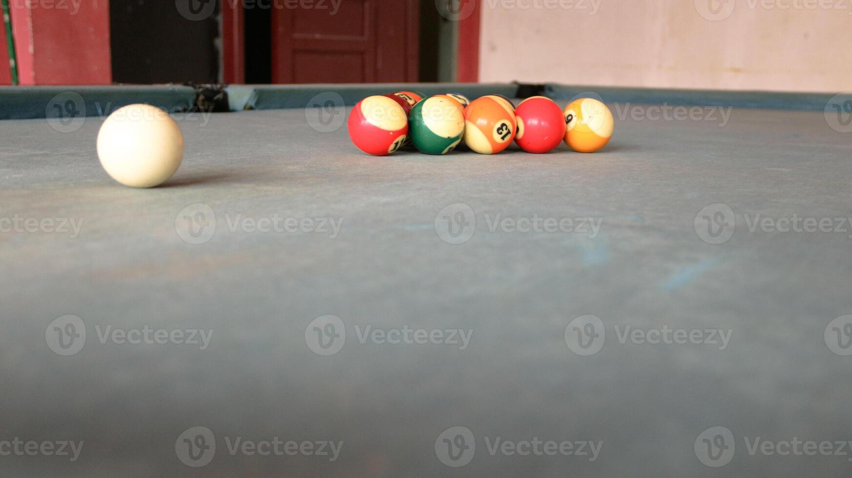 Billiards sports game. Multi-colored billiard balls with numbers on the pool table. Active recreation and entertainment. photo