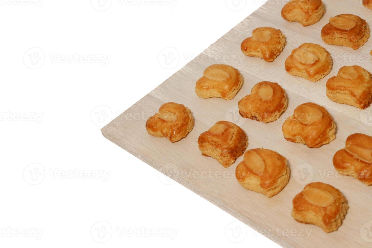 peanut almond cookies topped with sliced peanuts. photo