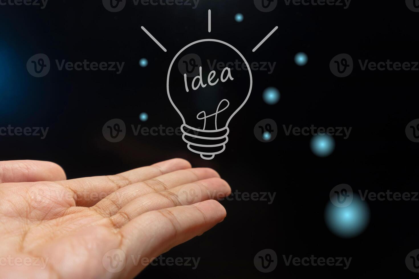 Hand with light bulb. Business idea concept with innovative technology and creativity. photo
