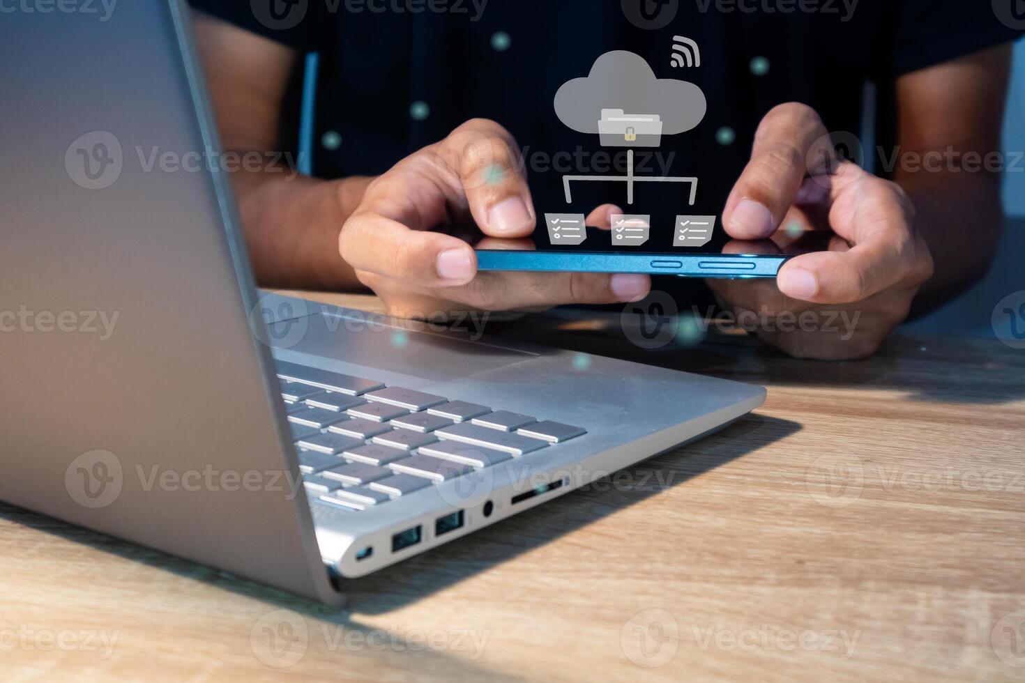 A man using mobile smartphone to manage files or documents with cloud computing. Backup storage technology concept. photo