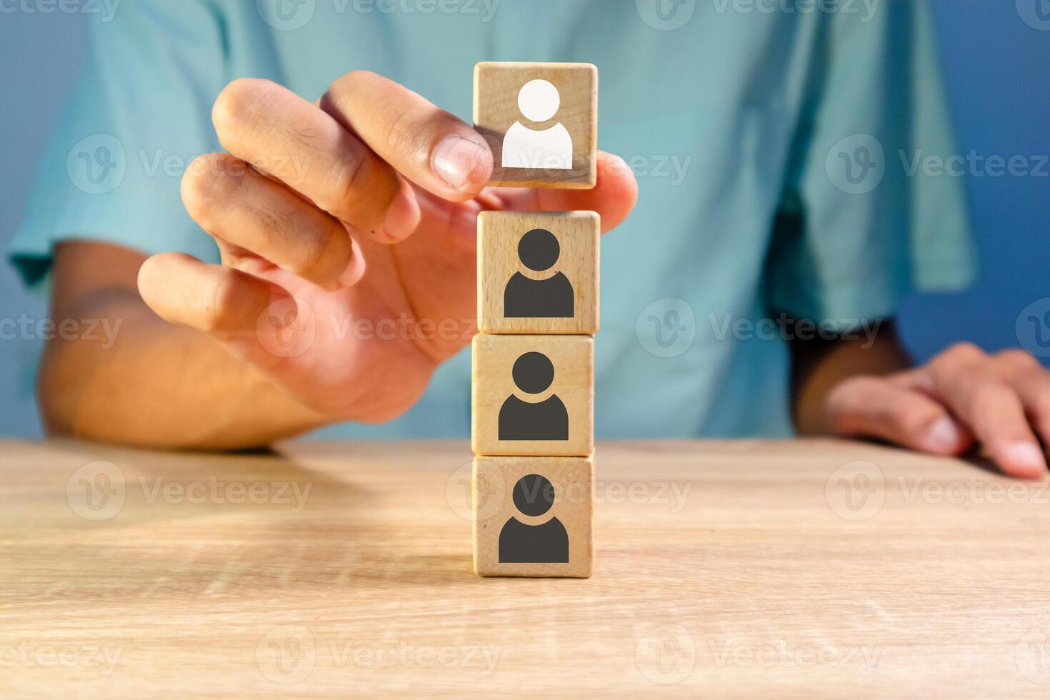 A man arranges the hierarchy of a company's business organization. Business organization hierarchy concept. photo