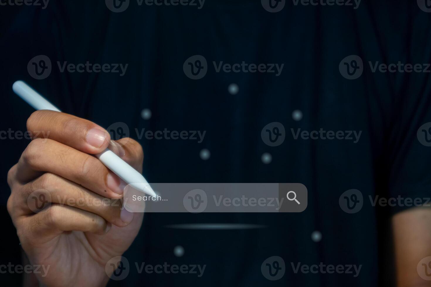 A man searching for information using internet on virtual screen. Search engine optimization concept. photo