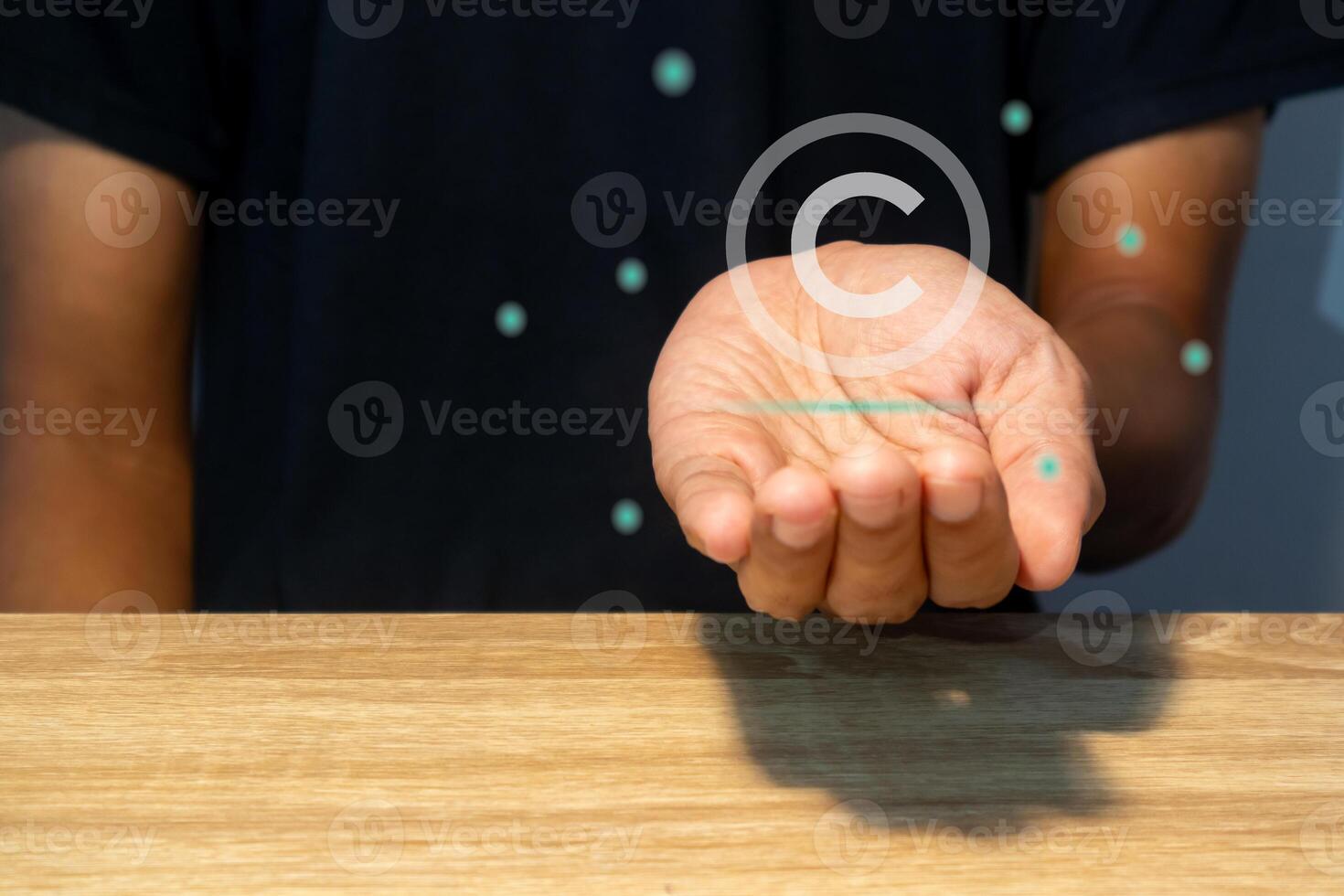 A man with virtual copyright symbol. Copyright, intellectual property protection, patent concept. photo