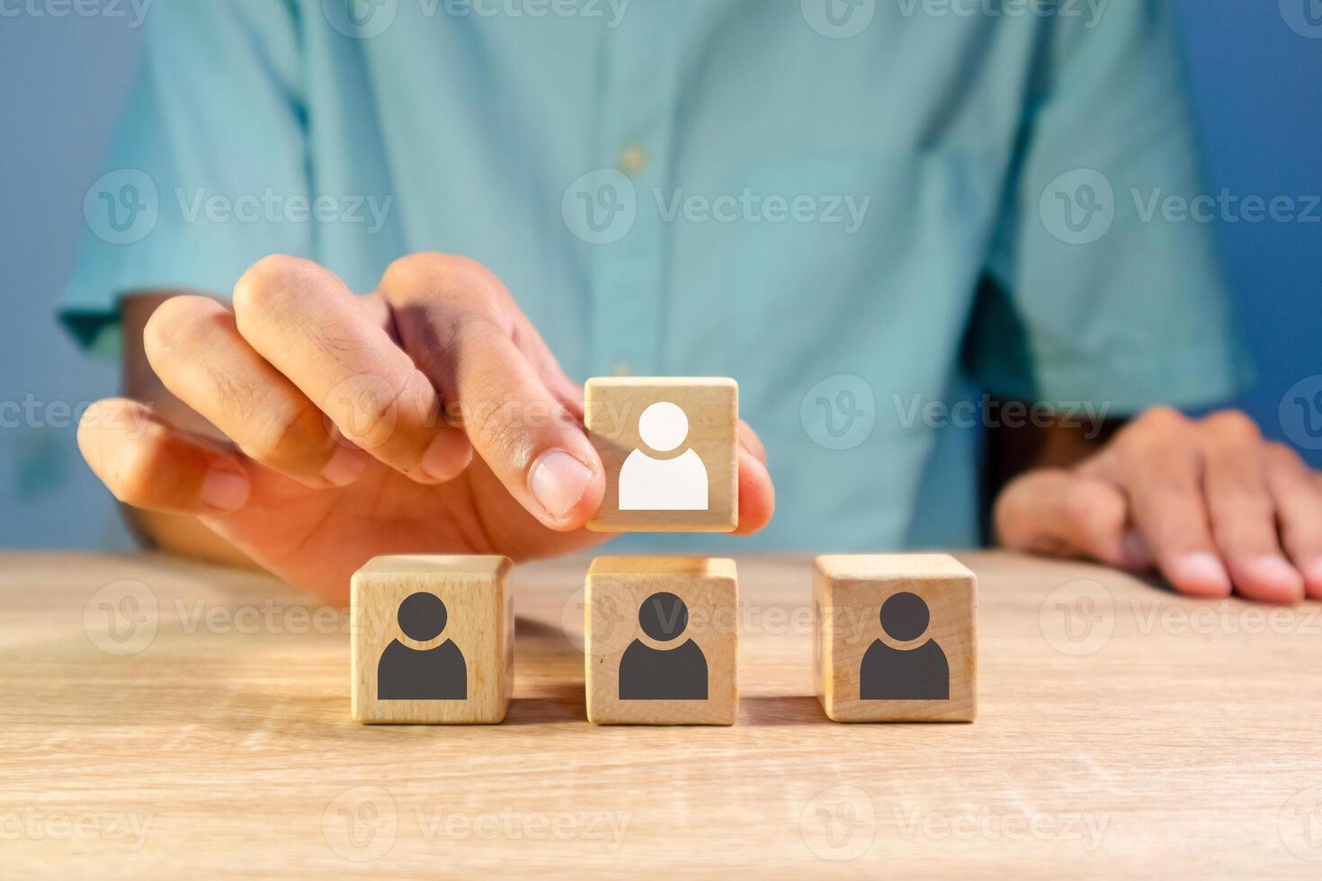 A man arranges the hierarchy of a company's business organization. Business organization hierarchy concept. photo