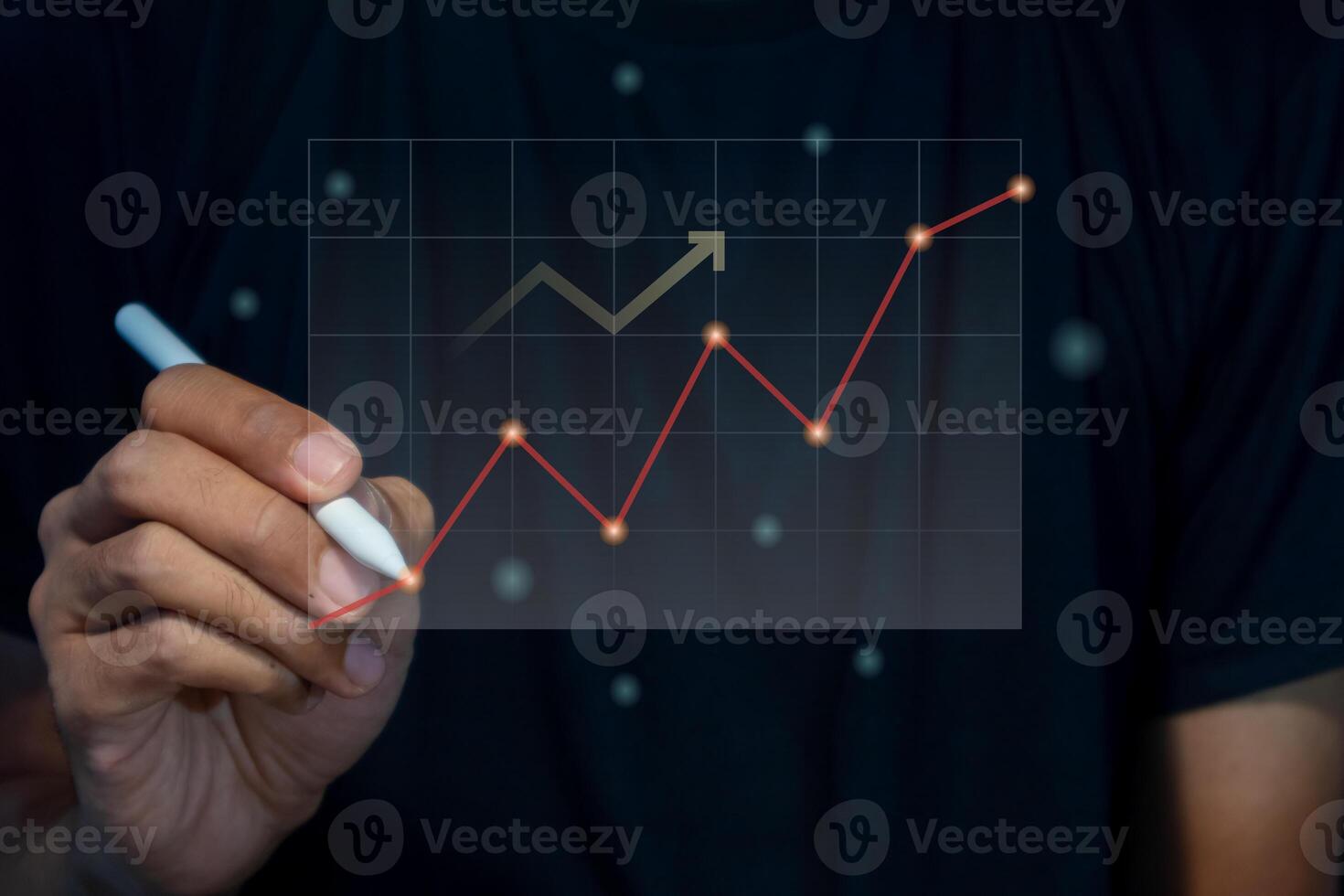 A man holding a pen with virtual screen of investment financial chart. Growth and successful concept. photo