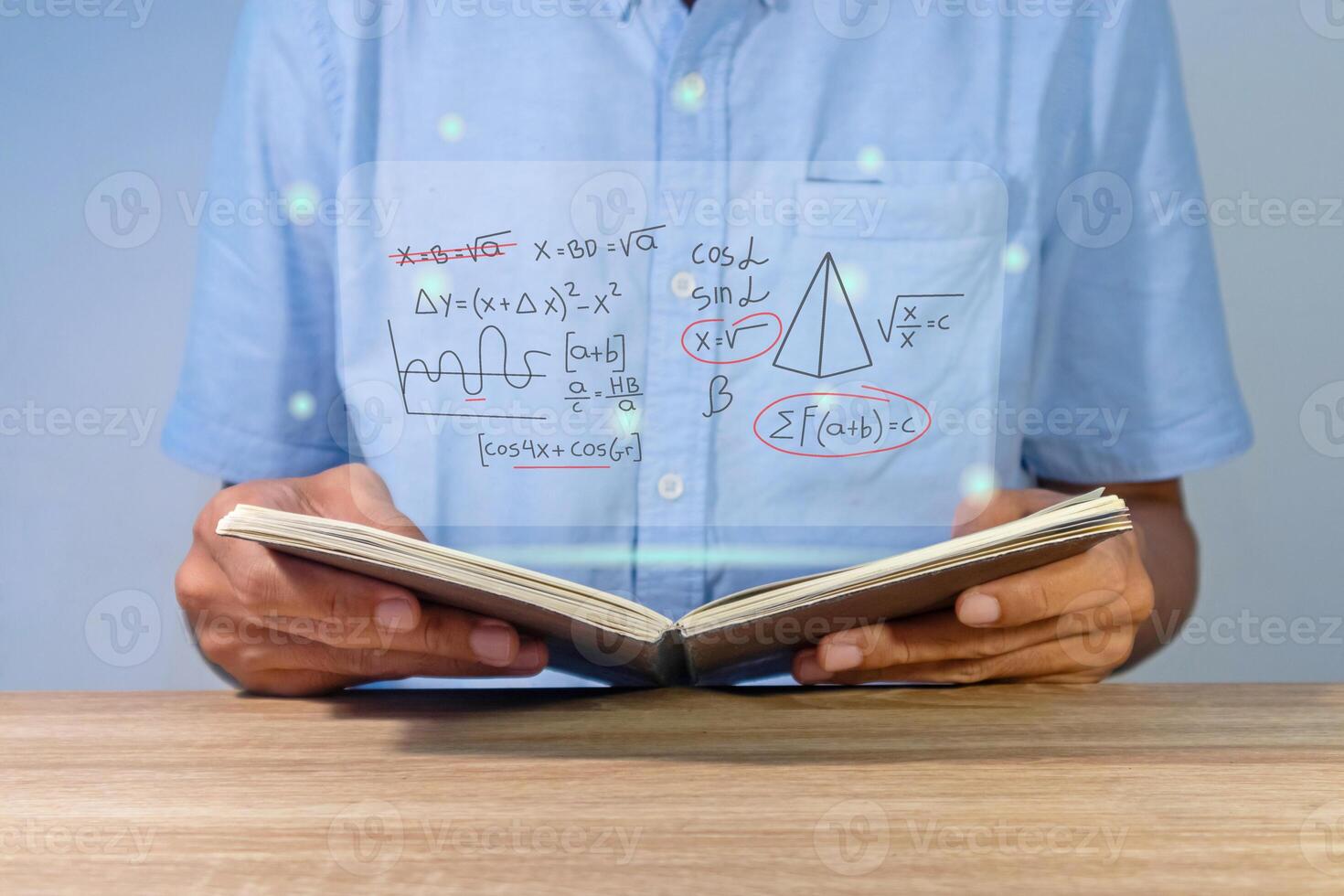 Man holding a notebook for studying mathematics photo