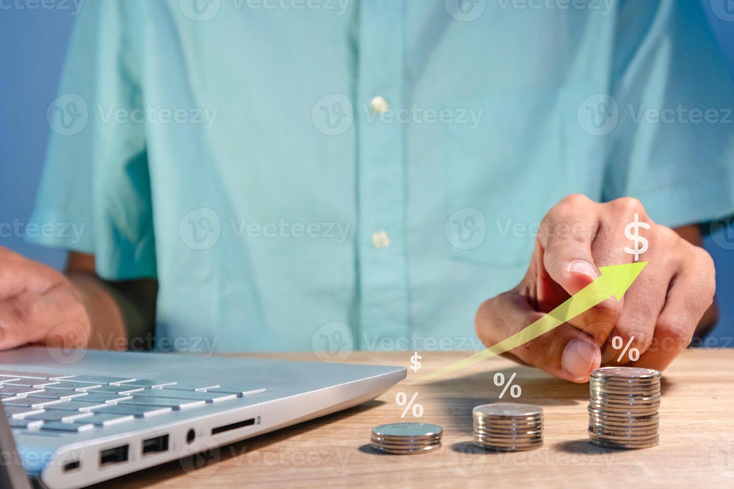 Man working with laptop to analyze business financial data report. Graph of increasing profit, revenue, price, sales, or interest. photo