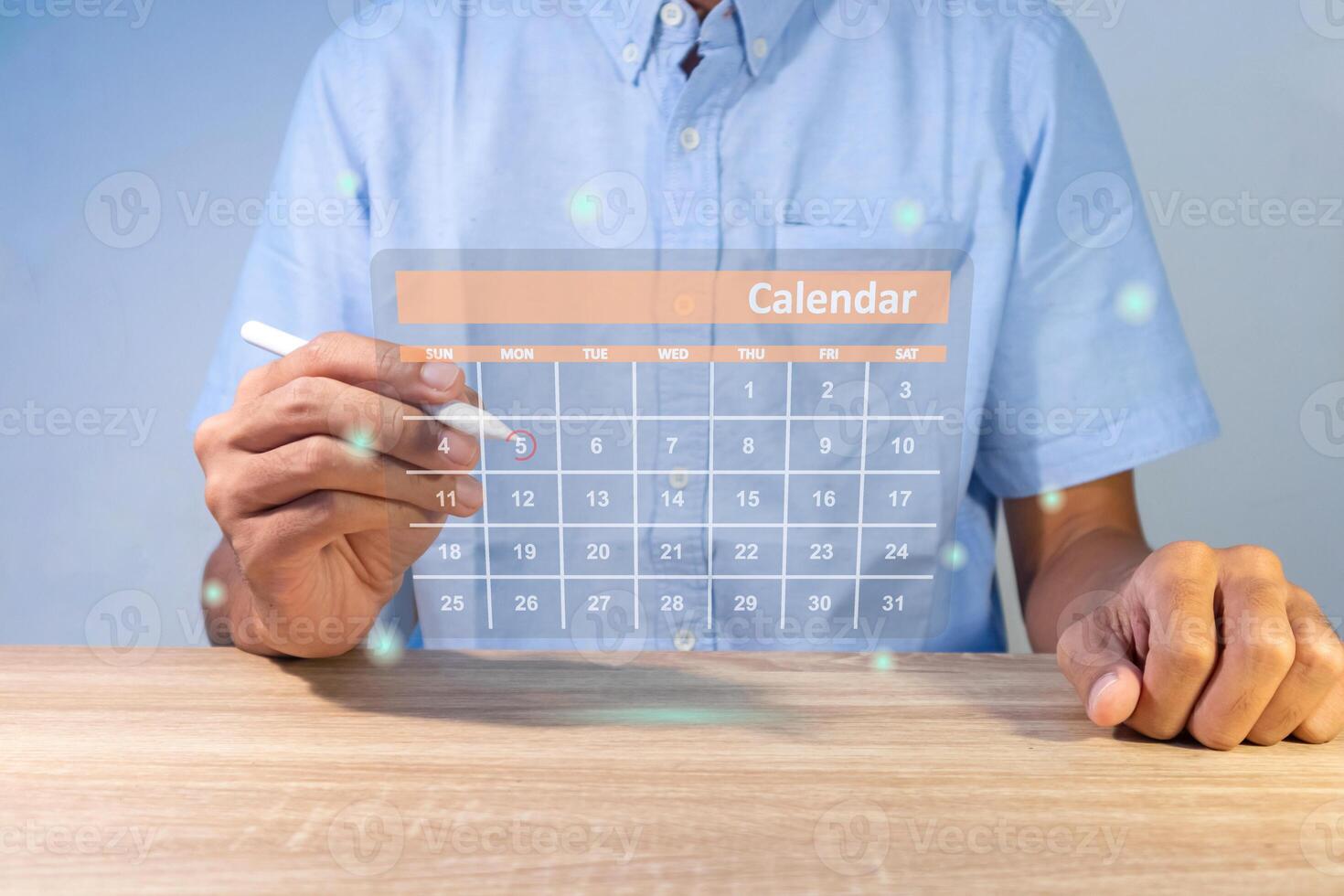 A man marking dates on virtual calendar. Highlight appointment, reminder, and meeting agenda. photo
