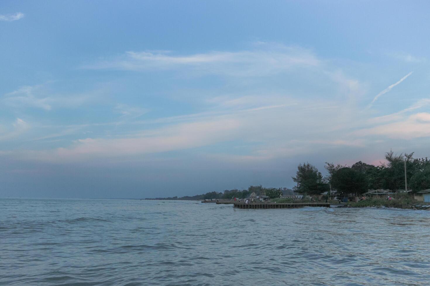 widuri coastal area of pemalang with blue sky photo