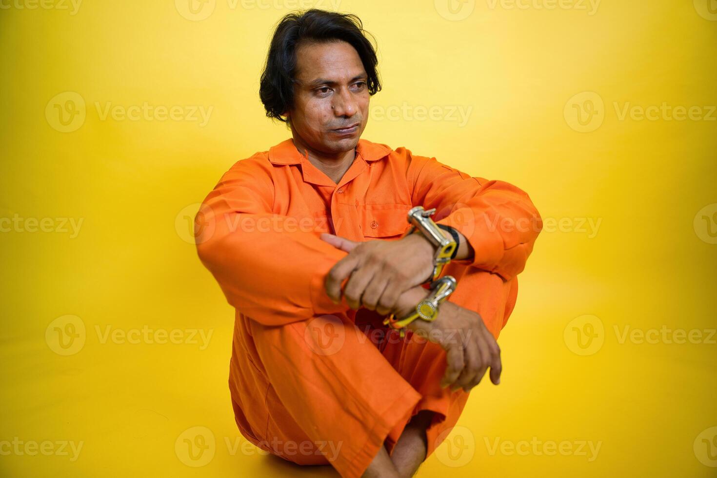 Depressed young man in prison photo